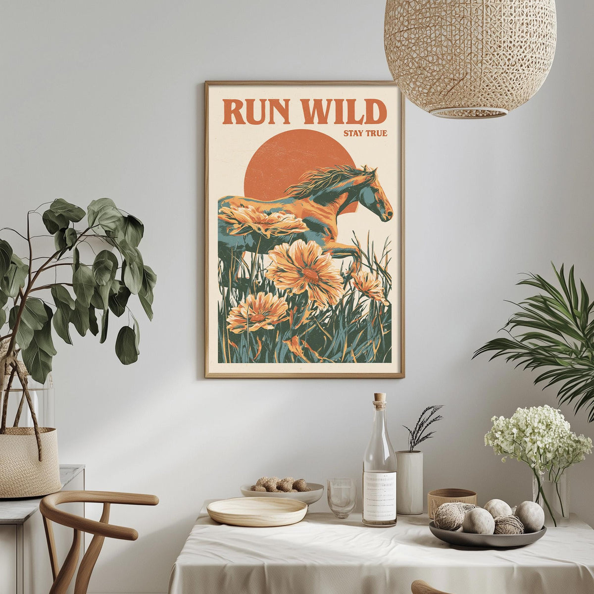 a framed poster of a horse surrounded by flowers, hanging on a wall above a dining table with various decorative items and plants.