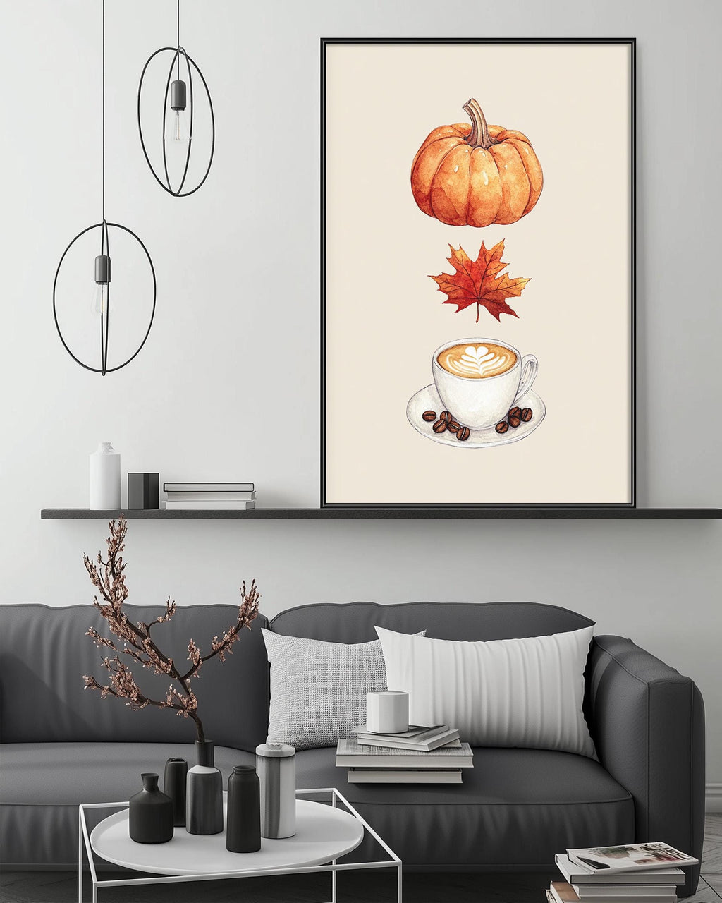 a cozy living room with a gray sofa, a coffee table, and a framed print of a pumpkin, coffee cup, and autumn leaves on the wall.