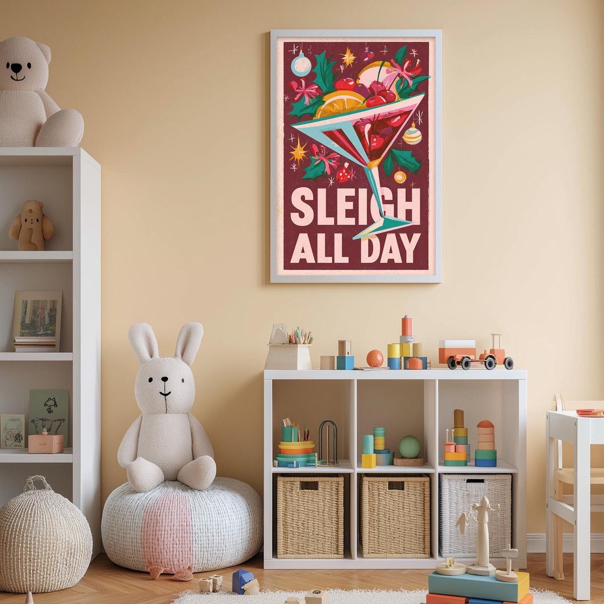 A cozy children's room with a white bookshelf, a plush rabbit, and a colorful poster on the wall. The poster features a cocktail glass with a festive design and the text "Sleigh All Day".