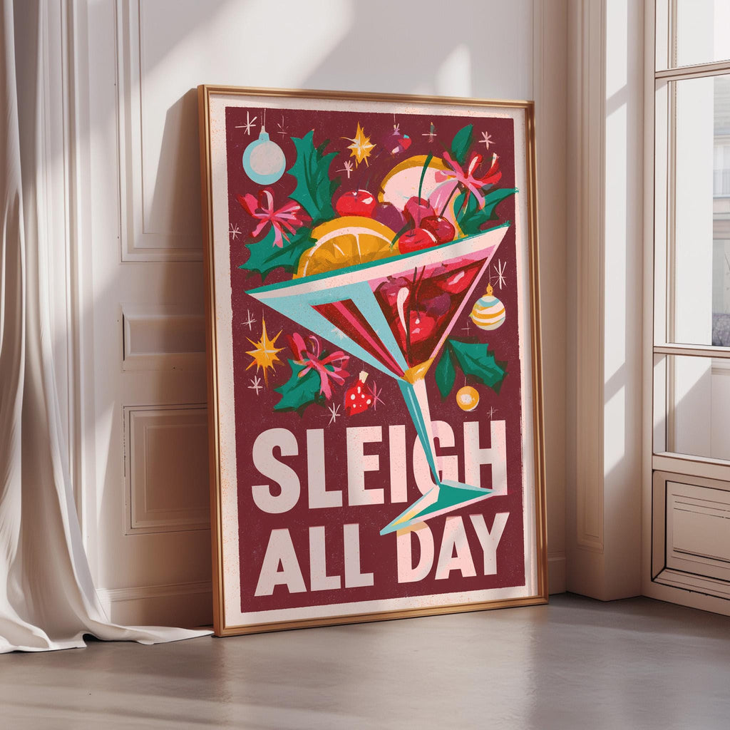 A framed poster with a colorful illustration of a cocktail glass filled with various fruits and flowers, along with the text "SLEIGH ALL DAY" prominently displayed.