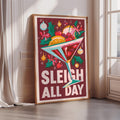 A framed poster with a colorful illustration of a cocktail glass filled with various fruits and flowers, along with the text "SLEIGH ALL DAY" prominently displayed.