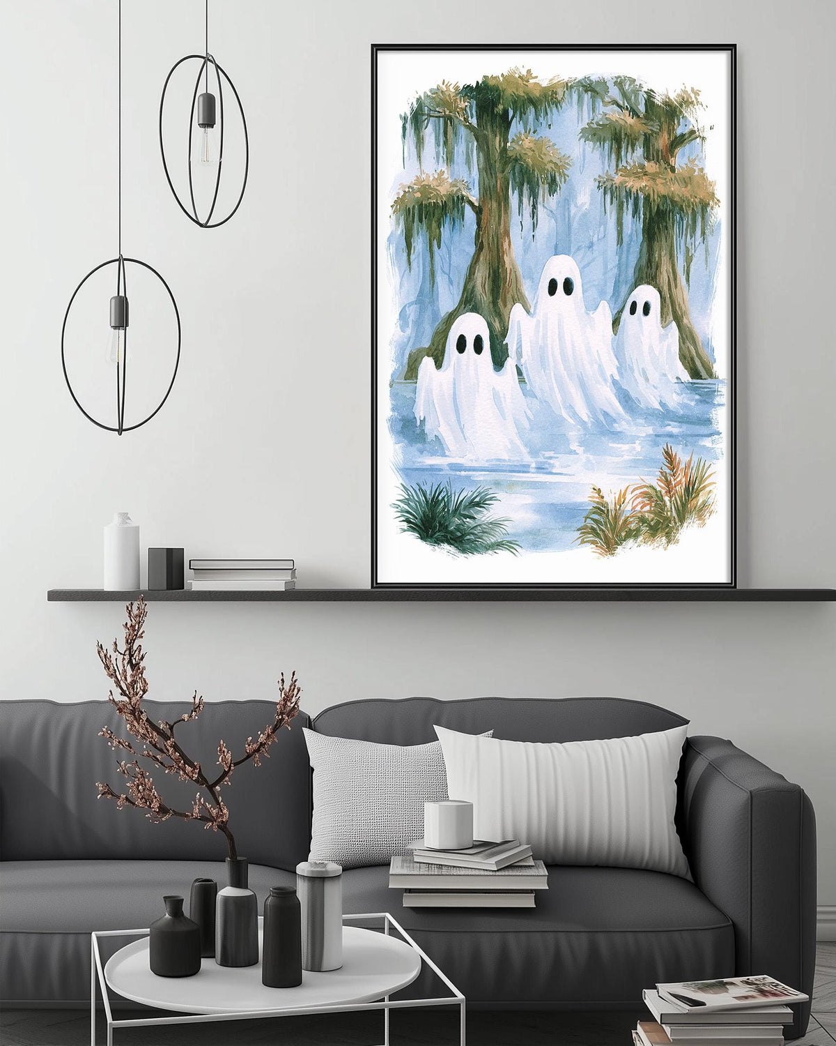 a living room with a gray couch, a coffee table, and a framed painting of ghostly figures in a swampy, forested area.