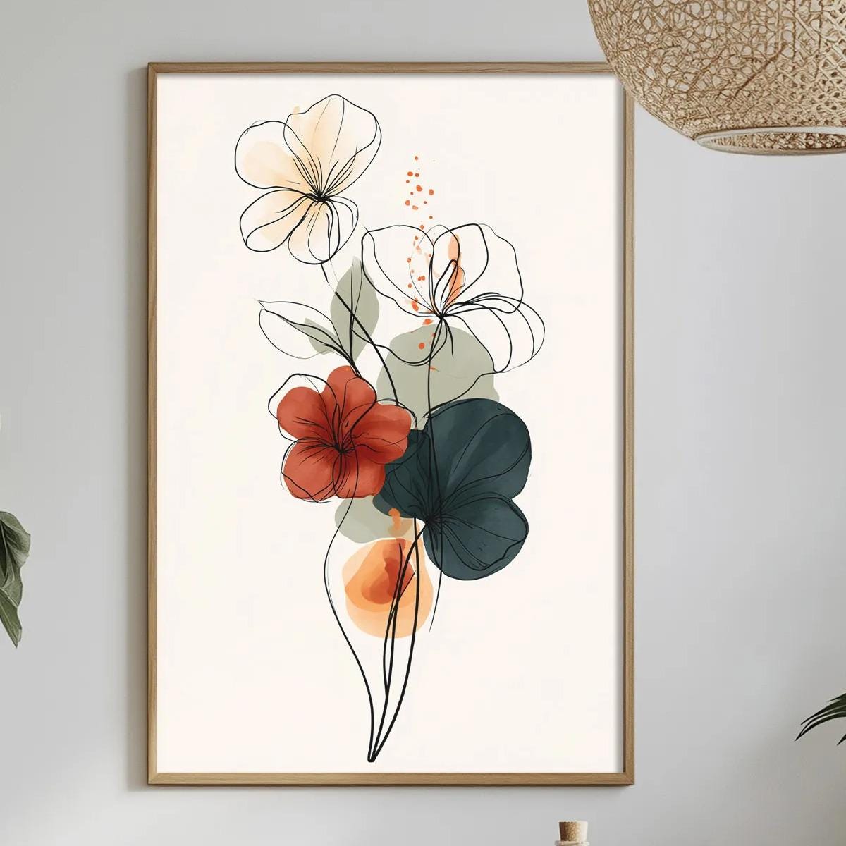 a dining table with a white tablecloth, a bowl of fruit, a bottle, and a vase with flowers. Above the table, there is a framed print of a floral design.