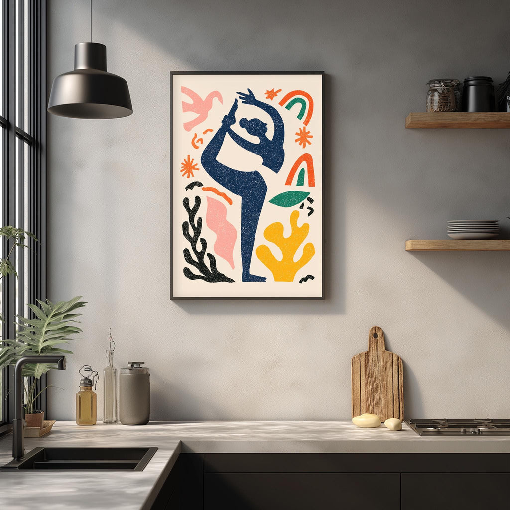 a modern kitchen with a framed abstract art piece hanging on the wall above a countertop. The art piece is colorful and depicts a stylized figure in a dynamic pose. The kitchen countertop has various items, including a cutting board, a soap dispenser, and a few bottles. The overall scene has a contemporary and artistic feel.