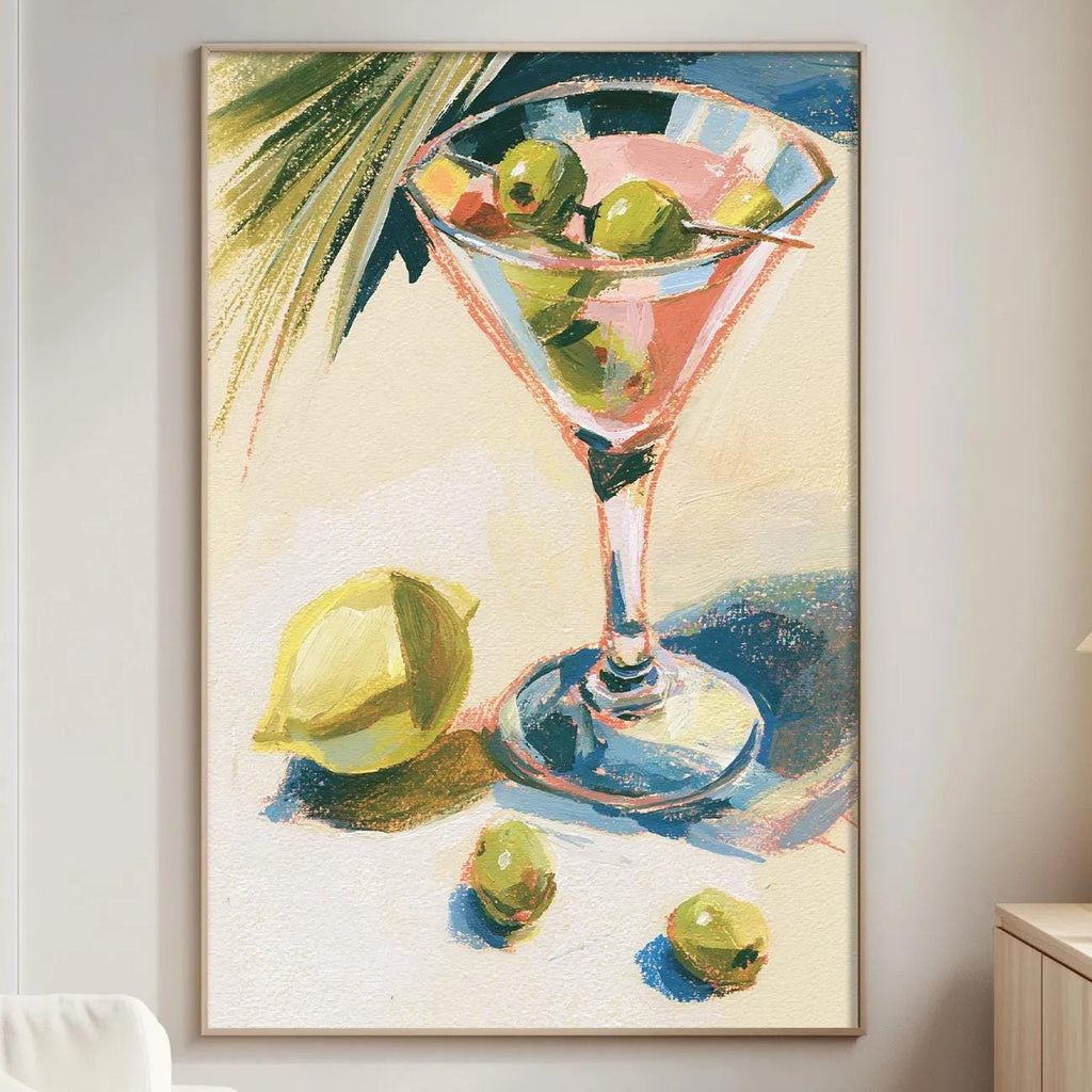 a large painting of a martini glass filled with olives, placed on a wall in a living room setting.