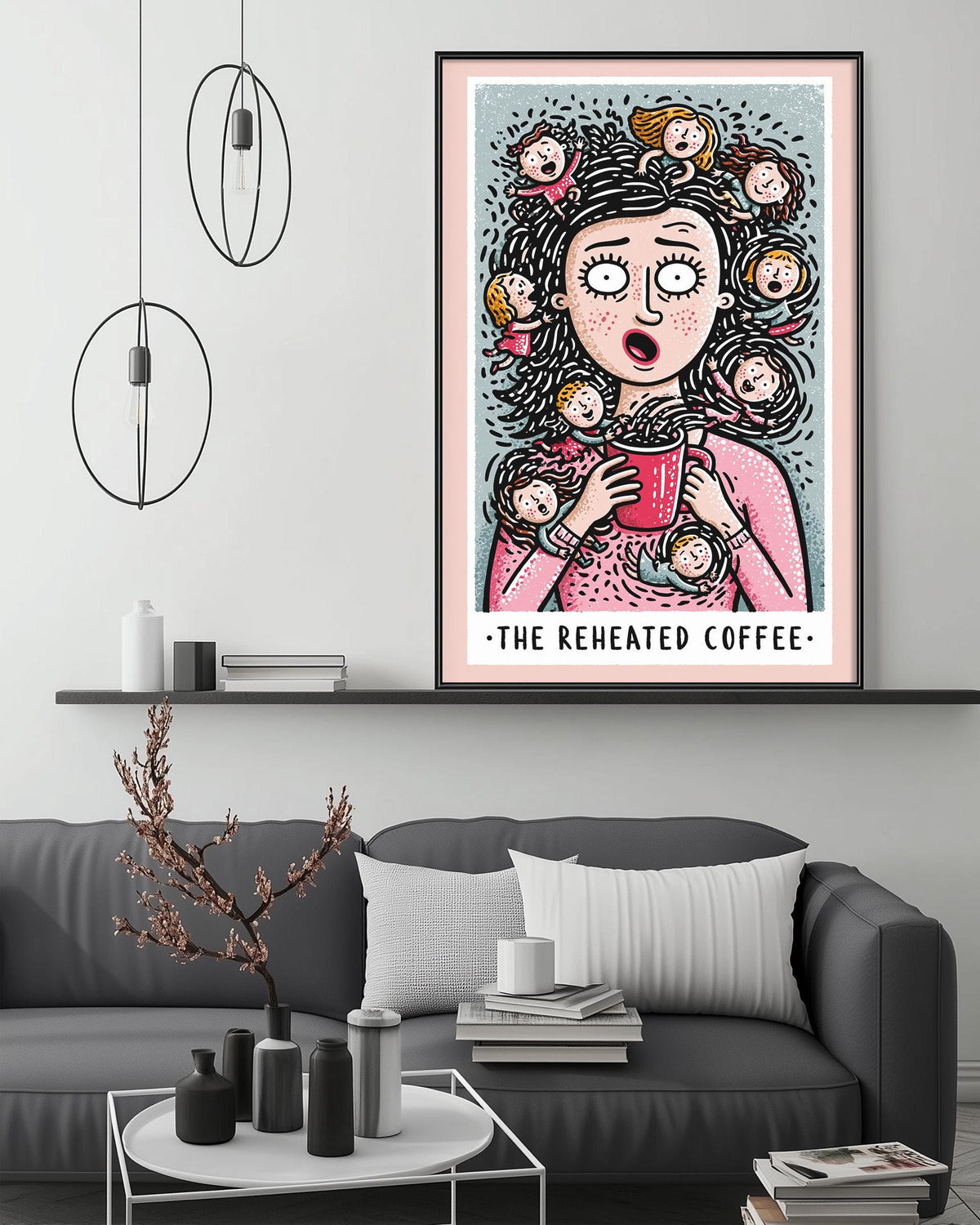 a cozy living room with a gray couch, a coffee table, and a large framed poster of a woman with a surprised expression. The poster also includes the text "The reheated coffee".