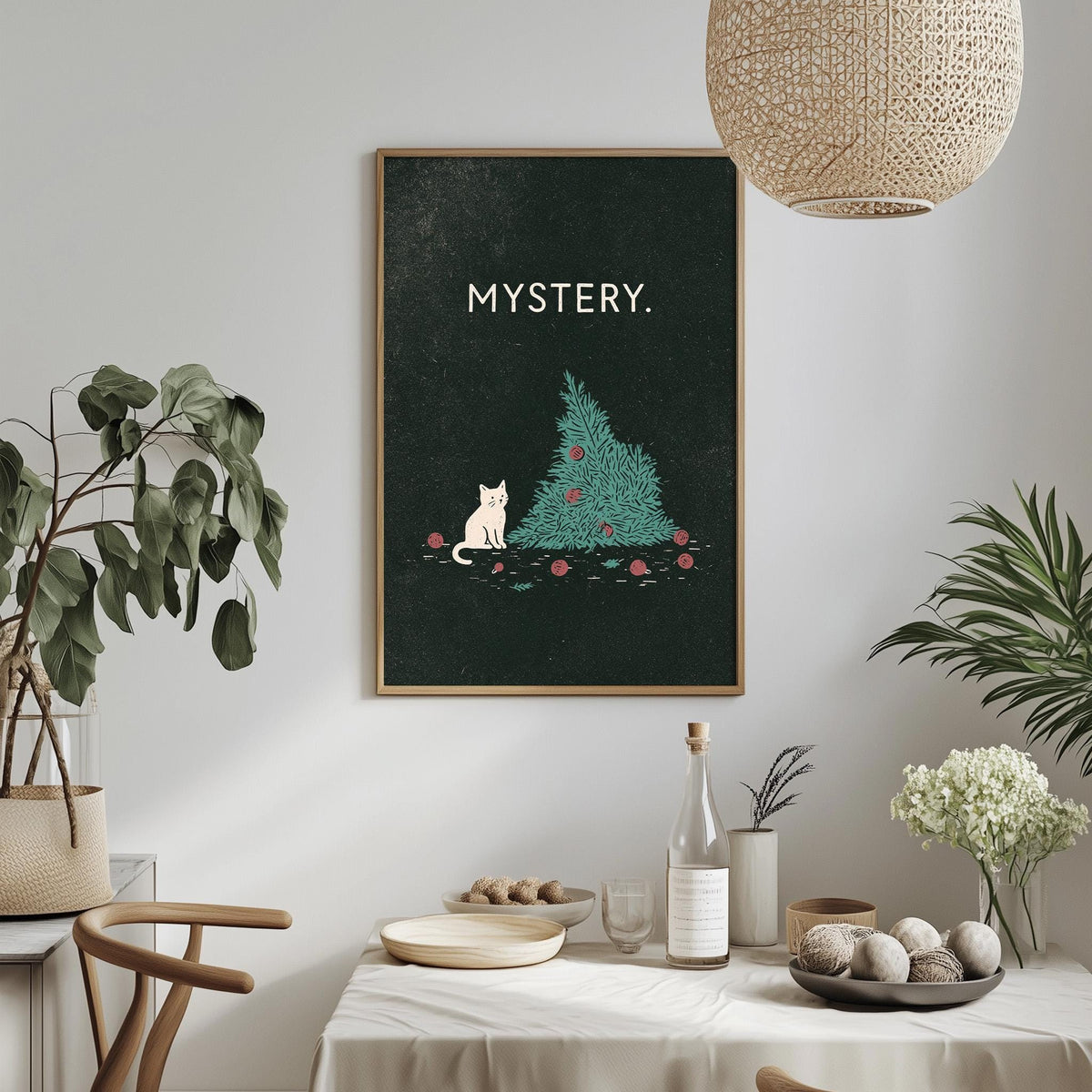 a cozy dining area with a framed poster of a cat sitting on a Christmas tree, surrounded by holiday decorations and plants.