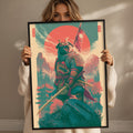 A woman is holding up a framed poster depicting a warrior figure with a sword and shield, set against a colorful, fantastical landscape with mountains and a red sun.
