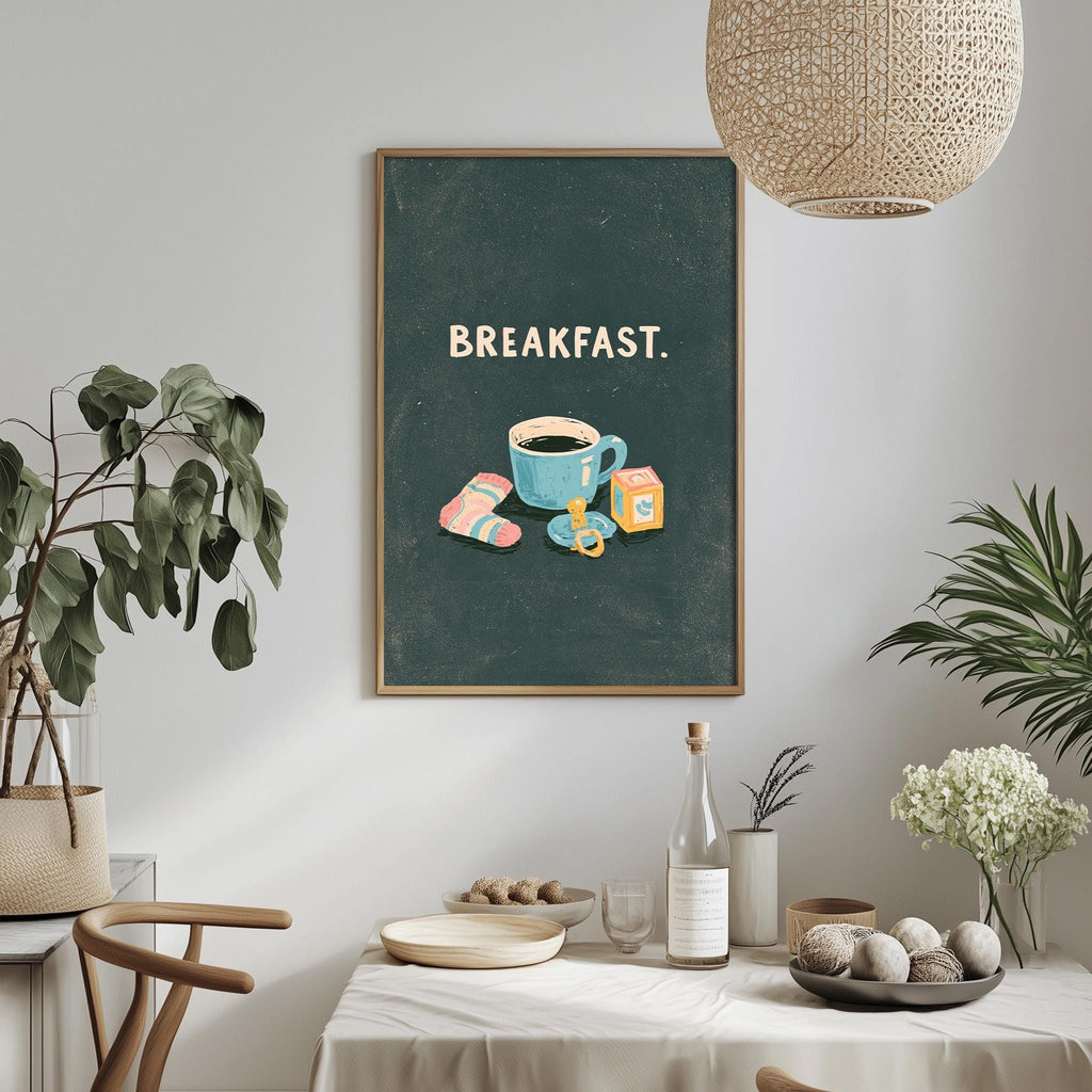 a dining table with a white tablecloth, a bowl of fruit, a bottle, and a vase with flowers. Above the table, there is a framed poster with the text "BREAKFAST" and an illustration of a cup of coffee and breakfast items.