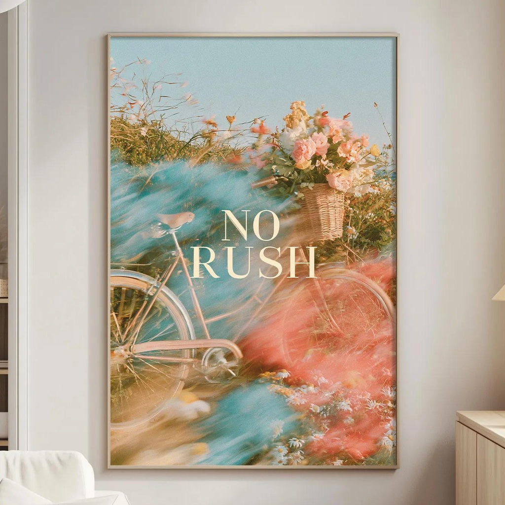 a large framed poster with a bicycle and flowers on the wall, along with a lamp and a couch in a living room setting.