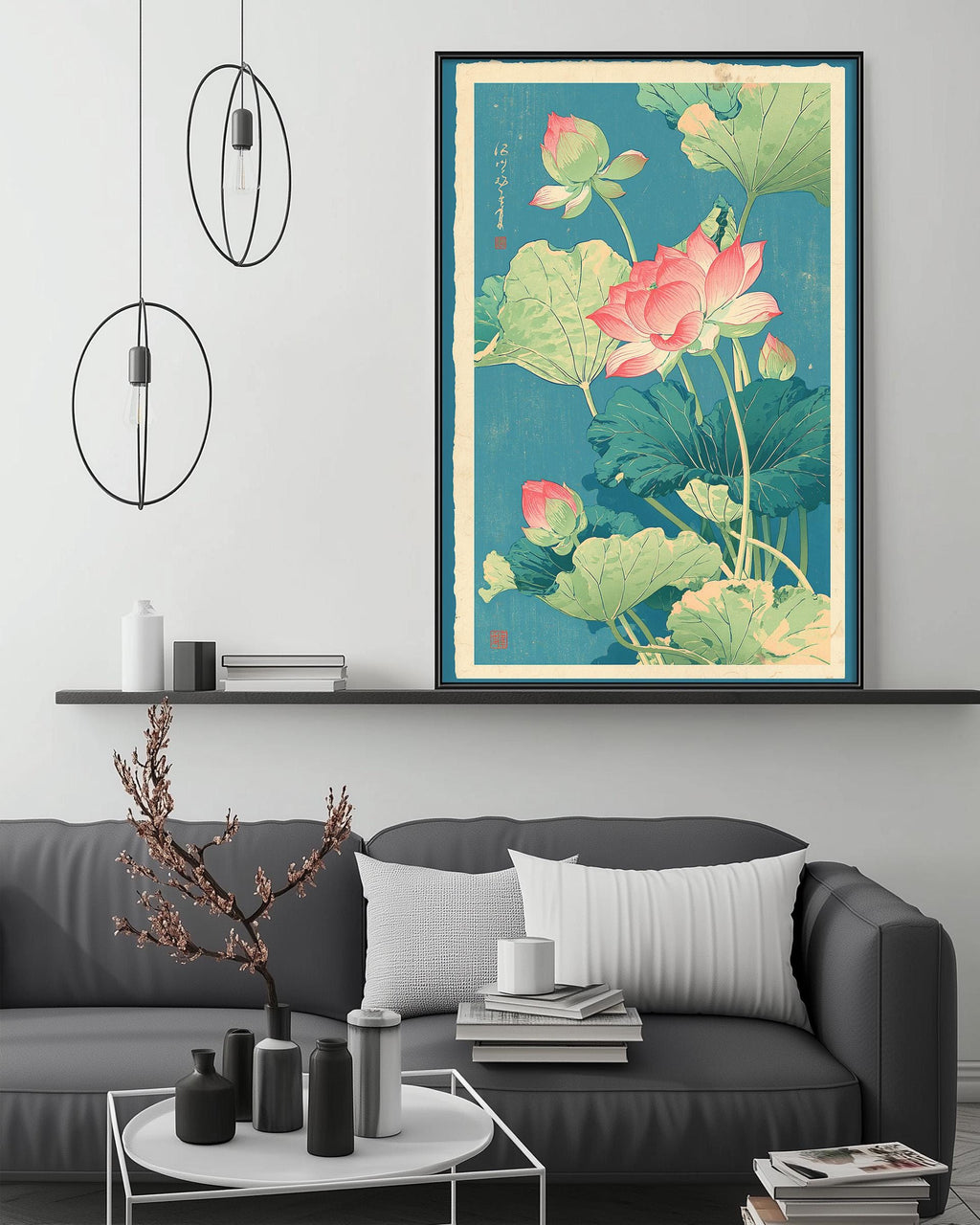 a large framed print of a floral design with pink and green flowers, hanging above a gray couch in a living room setting.