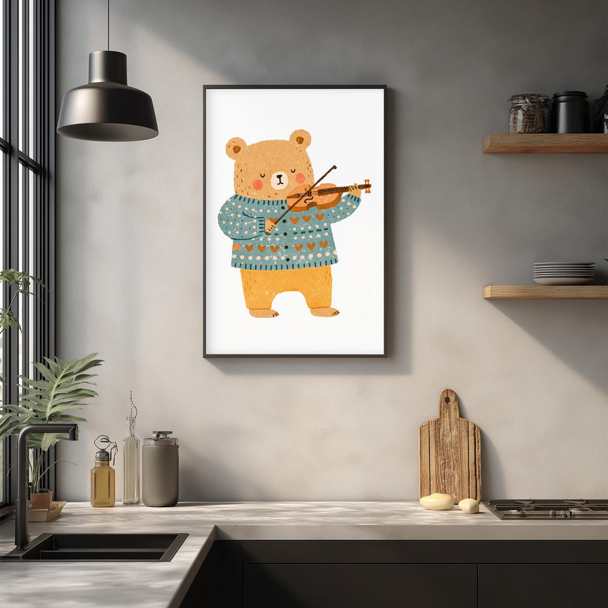 a kitchen counter with various items on it, including a framed illustration of a bear playing a violin, a wooden cutting board, and a potted plant.