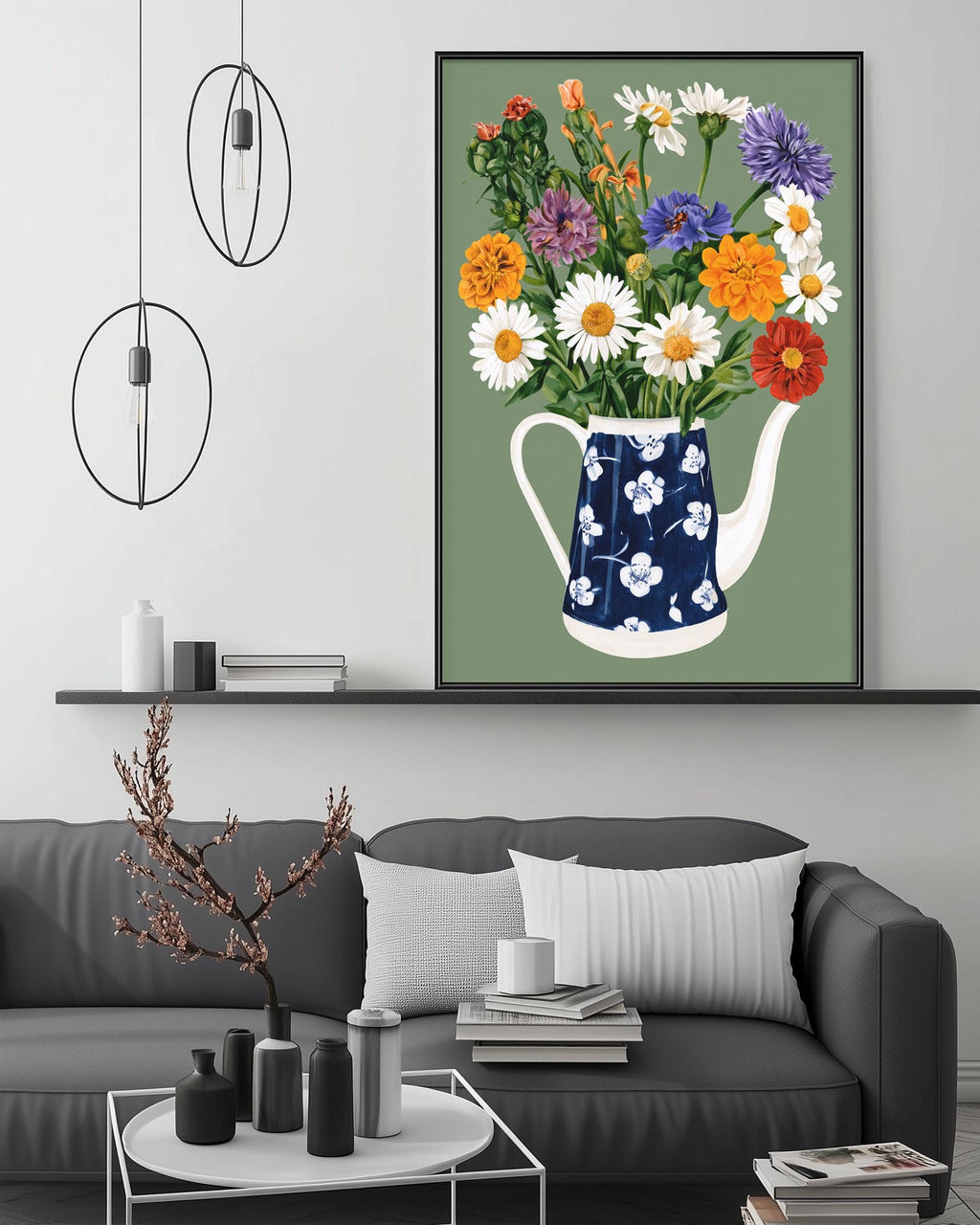a cozy living room with a gray sofa, a coffee table, and a large framed print of a vase filled with colorful flowers hanging on the wall above the sofa.
