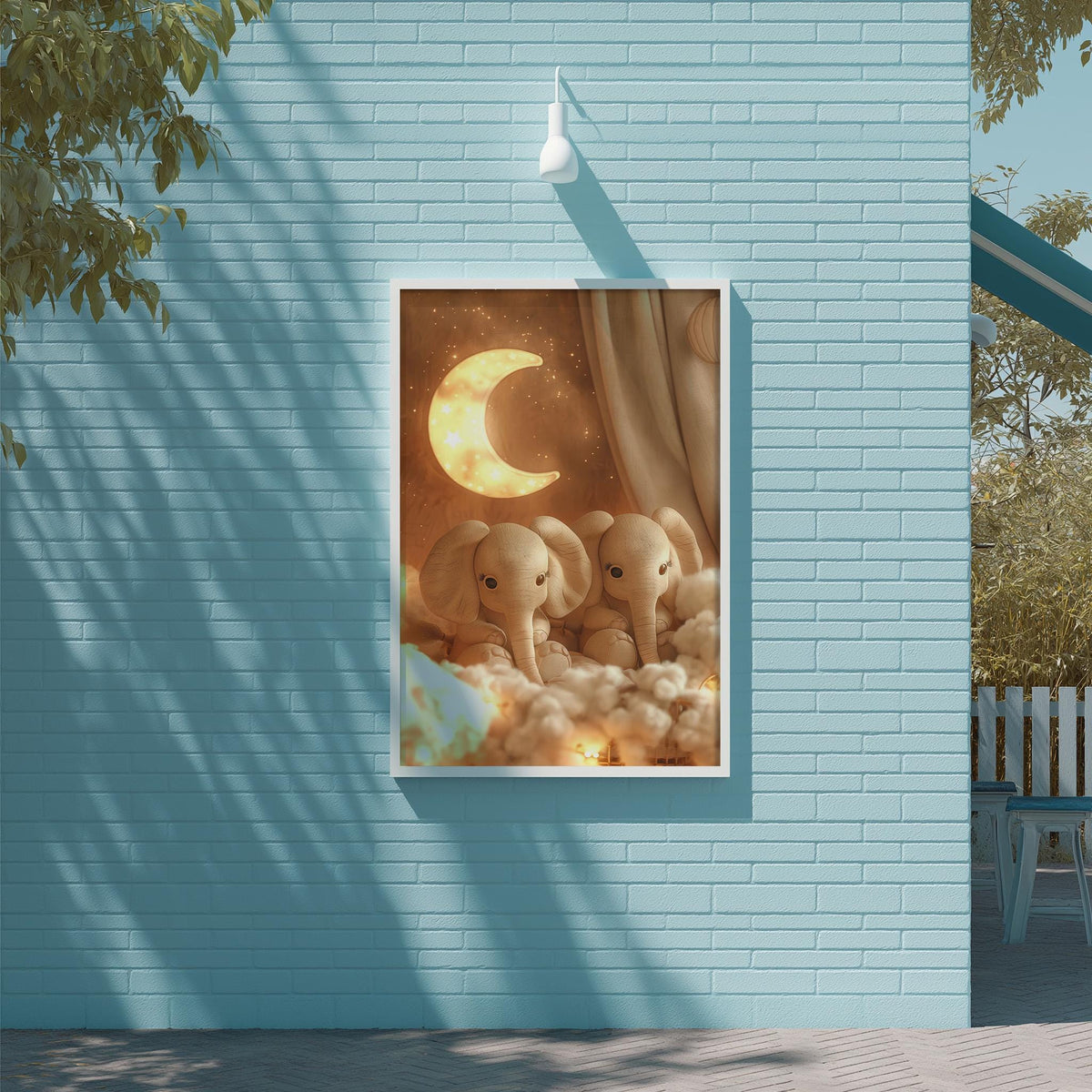 two elephants sitting together under a crescent moon, with a brick wall and a tree in the background.