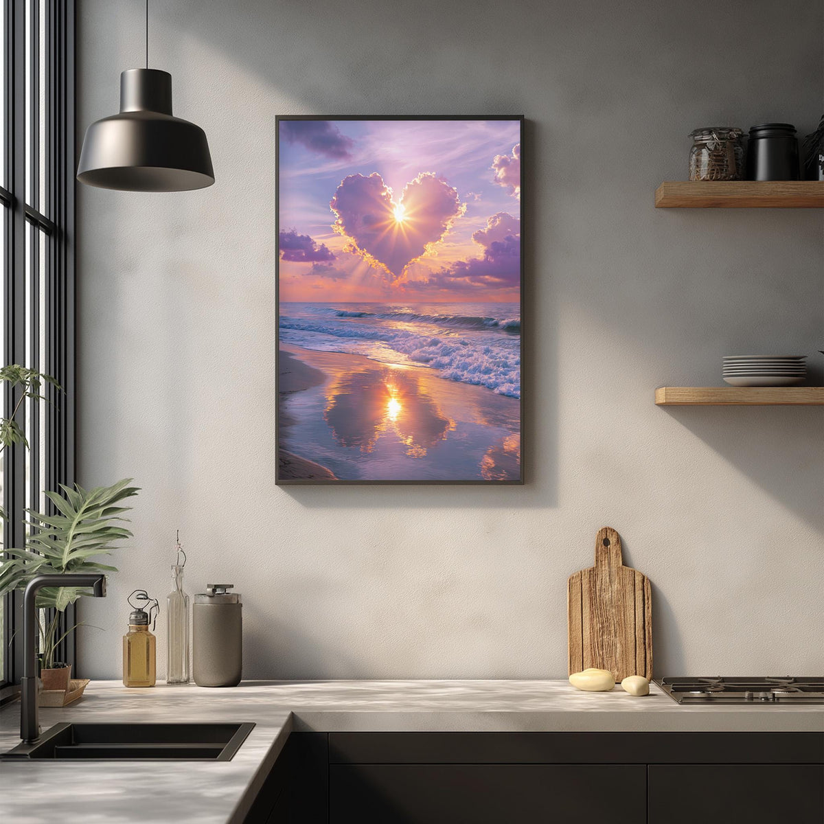 a serene beach scene with a heart-shaped cloud formation in the sky, reflecting the warm colors of the setting sun. The image is framed and hung on a wall above a kitchen counter, which has various kitchen items such as a cutting board, a bottle, and a vase.