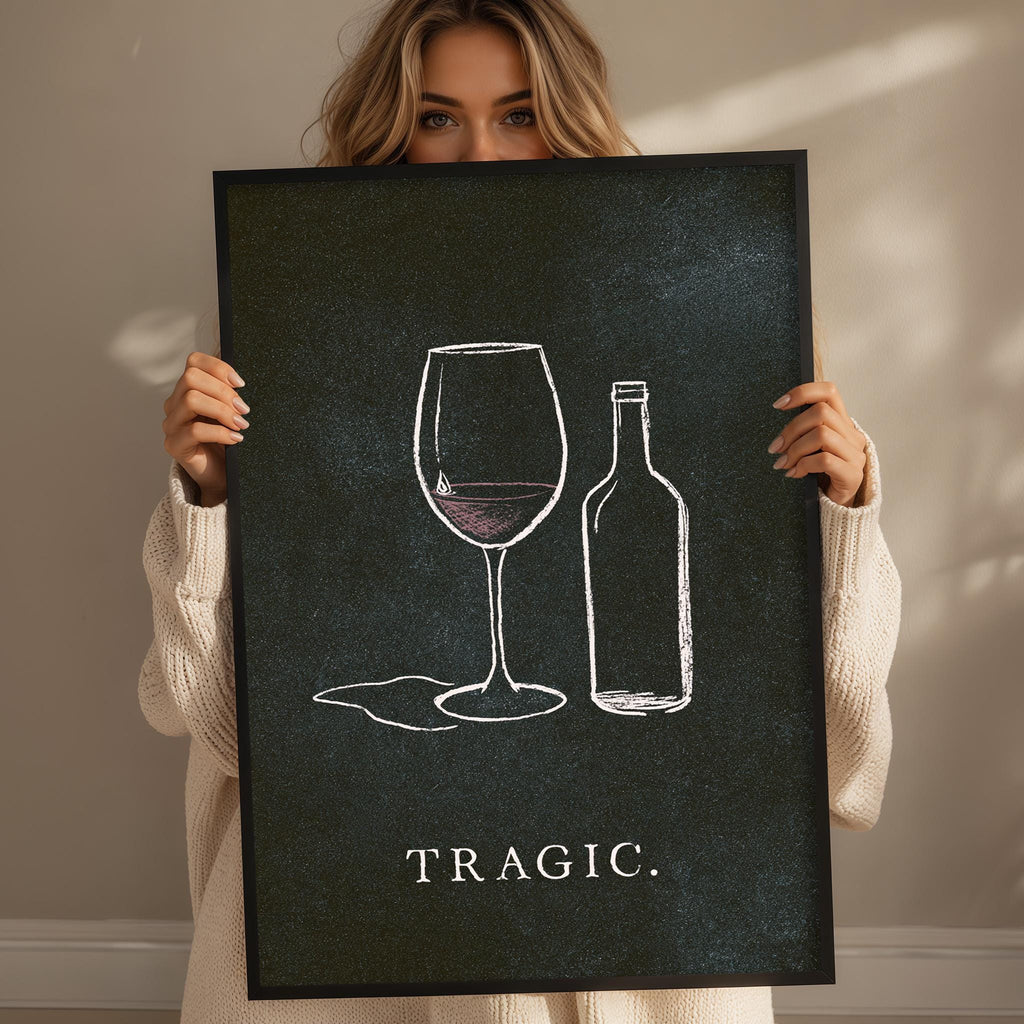 A woman holding a black and white poster with the word "TRAGIC" written on it.