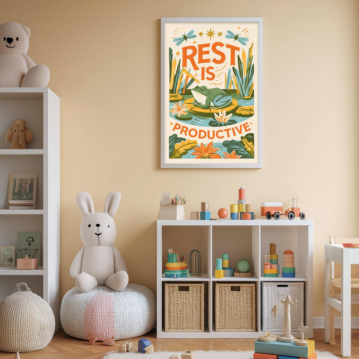 A child's bedroom with a white bookshelf, a stuffed rabbit, and a colorful poster on the wall. The poster features the text "REST IS PRODUCTIVE" and an illustration of a frog in a pond.
