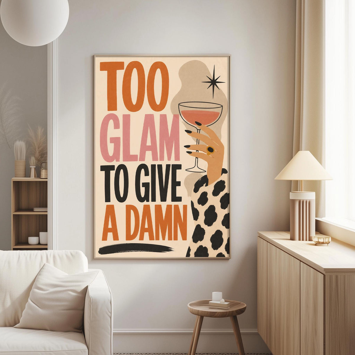 a poster with the text "Too Glam to Give a Damn" displayed on a wall in a living room setting.