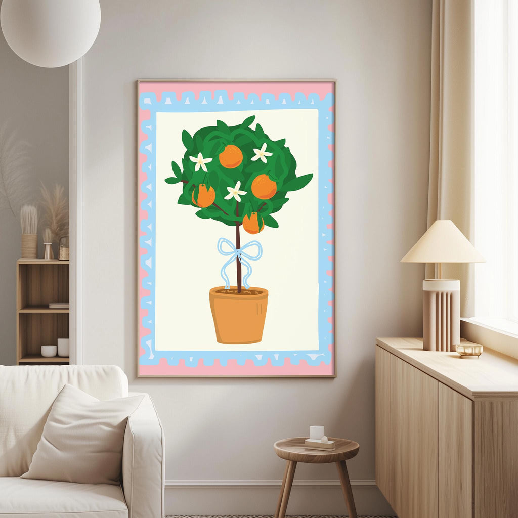 a cozy living room with a white sofa, a wooden side table, and a lamp. A large framed picture of a potted tree with oranges and white flowers is hanging on the wall, adding a touch of nature and color to the room.