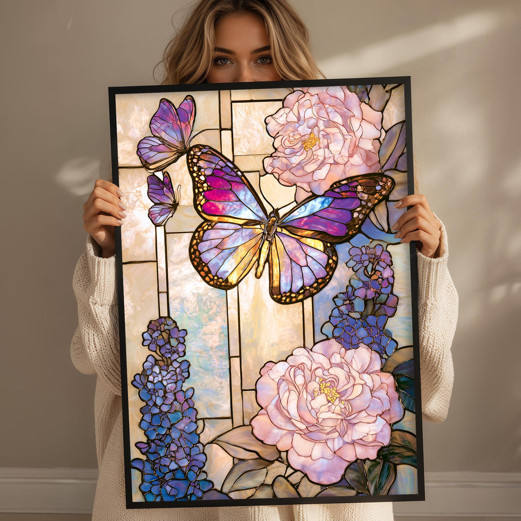 A woman holds up a framed stained glass artwork featuring a butterfly and flowers.