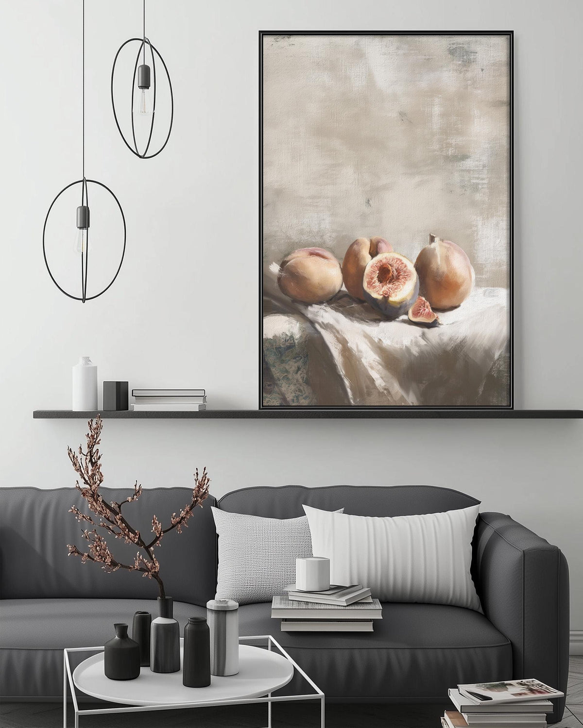 a modern living room with a gray sofa, a coffee table, and a large painting of fruit on the wall above the sofa.