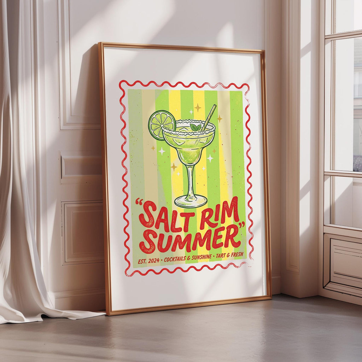 A framed poster with a colorful illustration of a margarita glass and the text "Salt rim summer" is displayed on a wall.