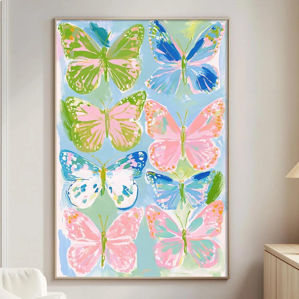 a large, colorful painting of butterflies hanging on a wall in a living room.