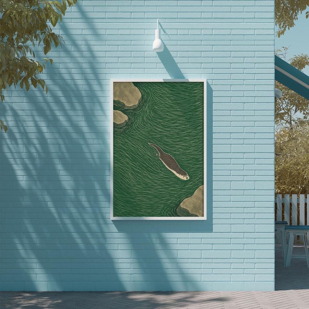 a blue wall with a framed illustration of a seal swimming in the water, which is mounted on the wall.