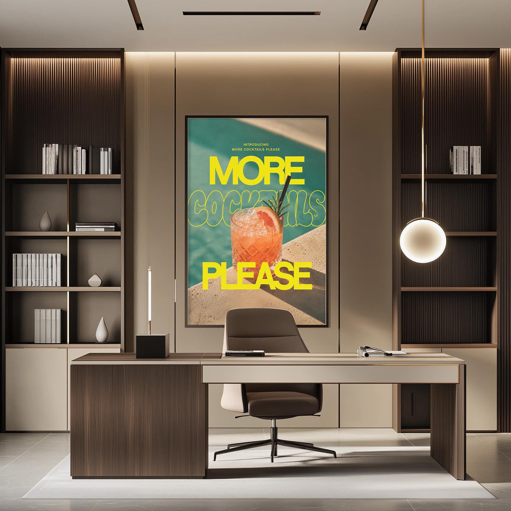 a modern office space with a large framed poster on the wall that says "MORE COCKTAILS PLEASE". The poster displays an image of a cocktail glass and the text "MORE COCKTAILS" in yellow. The office has a desk with a chair, and there are bookshelves on either side of the desk.