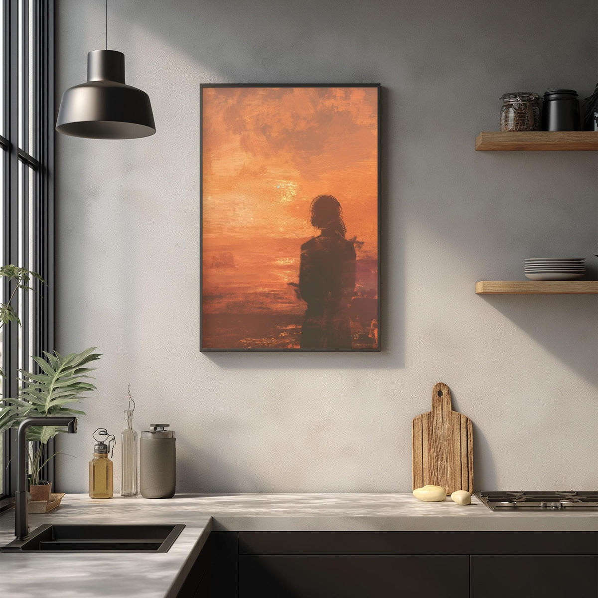 a kitchen counter with various kitchen items, including a cutting board, a soap dispenser, and a plant. Above the counter, there is a framed picture of a woman with a silhouette against a sunset background.