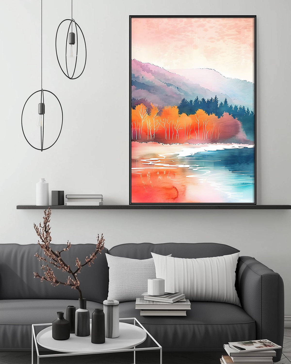 a modern living room with a gray sofa, a coffee table, and a large framed landscape painting hanging on the wall above the sofa.
