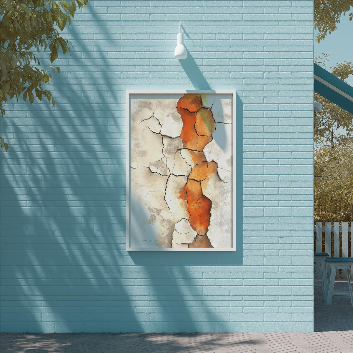 a blue brick wall with a framed painting of a cracked and weathered wall in the center.
