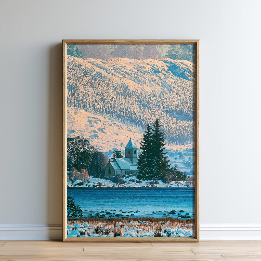 A framed photograph depicting a serene winter landscape with a church, trees, and a body of water.