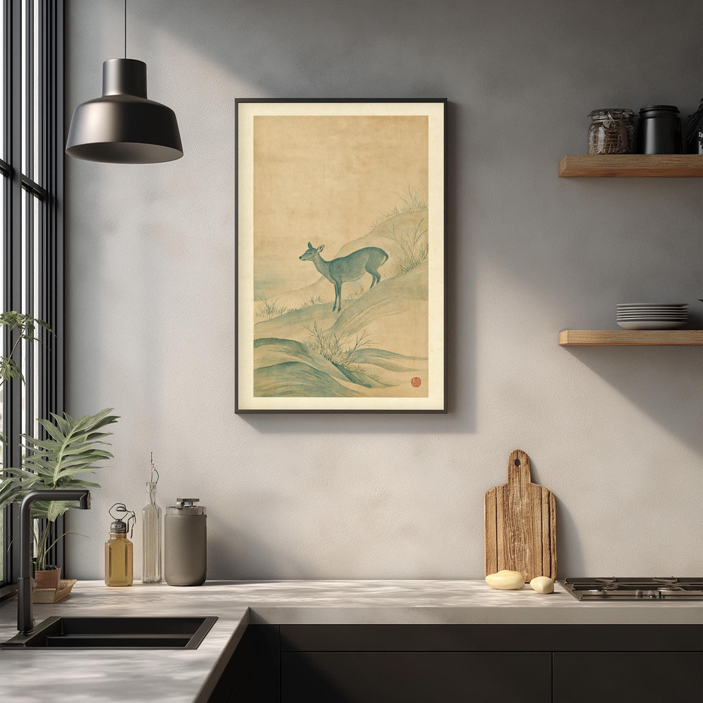 a kitchen counter with a framed picture of a deer, a wooden cutting board, and various kitchen items such as a bottle, a vase, and a bowl.