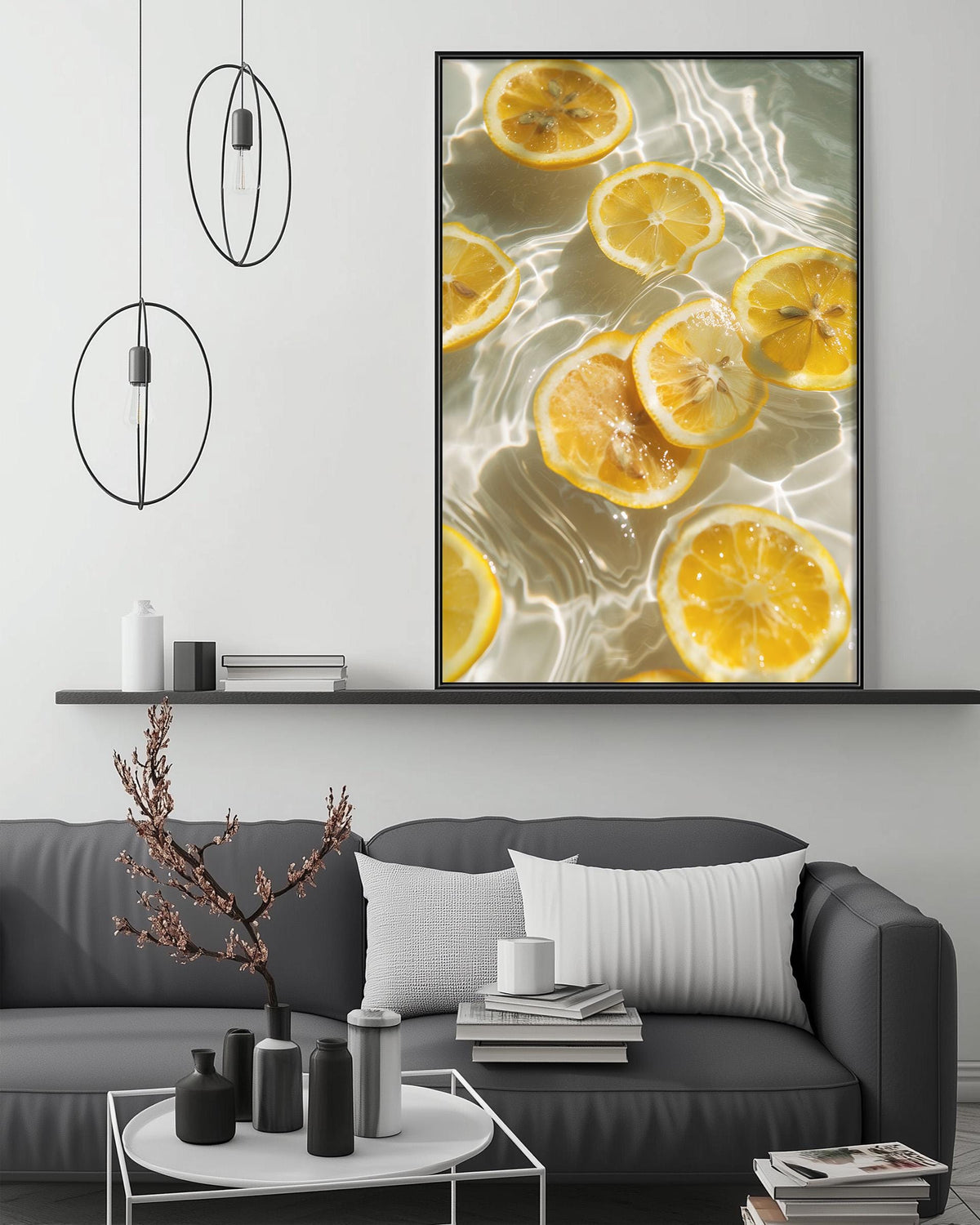 a modern living room with a gray sofa, a coffee table, and a large framed photograph of sliced lemons in water hanging on the wall above the sofa.
