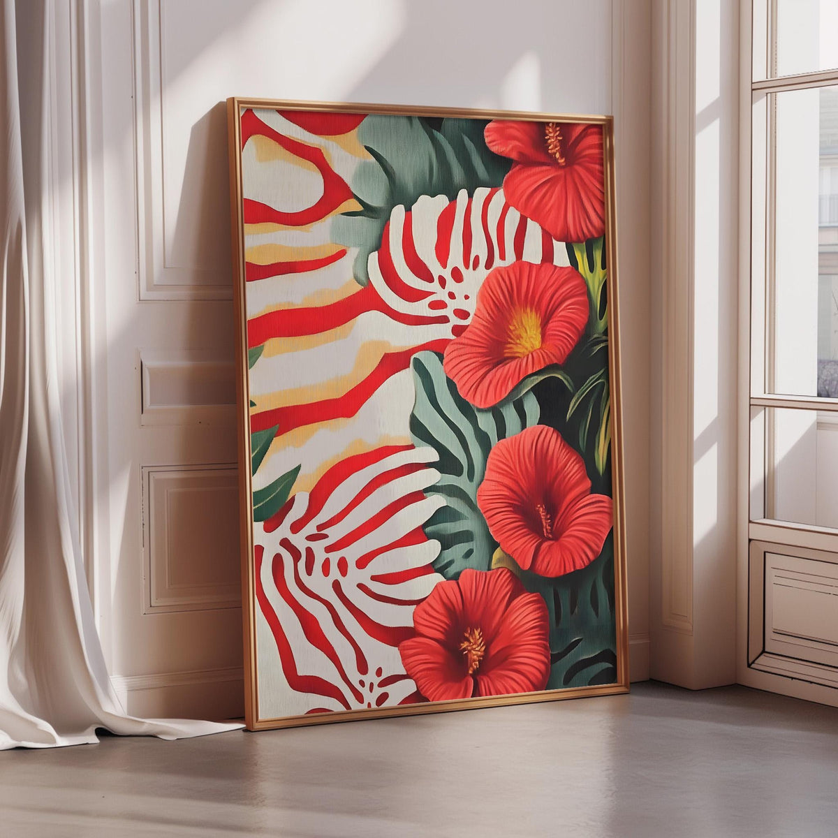 A large framed painting depicting vibrant red hibiscus flowers and lush tropical foliage is displayed in a room with a white wall and a window.