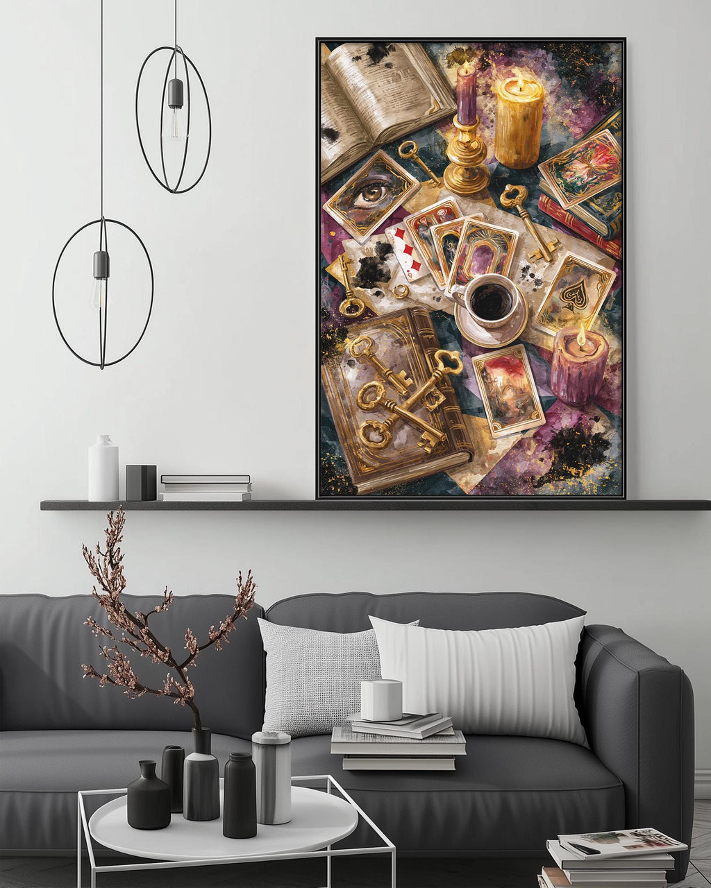 a cozy living room with a gray sofa, a coffee table, and a large framed artwork depicting a collection of objects, including a book, a candle, and a deck of cards.