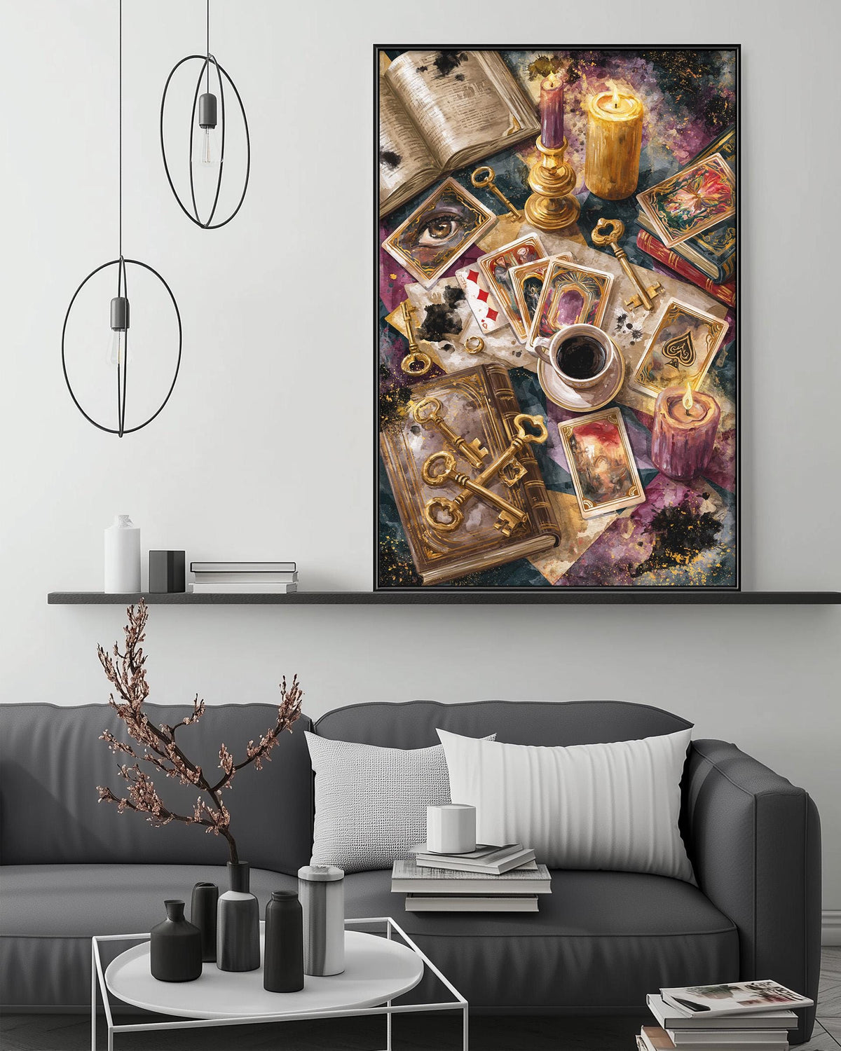 a cozy living room with a gray sofa, a coffee table, and a large framed artwork depicting a collection of objects, including a book, a candle, and a deck of cards.