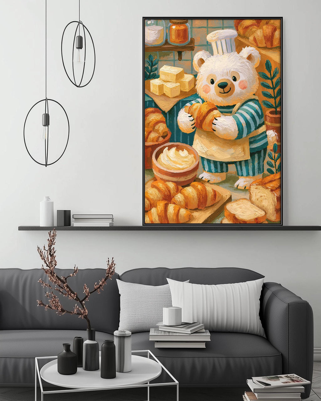 a cozy living room with a gray couch, a coffee table, and a large framed painting of a bear holding a loaf of bread. The painting is hanging on the wall above the couch, creating a warm and inviting atmosphere in the space.