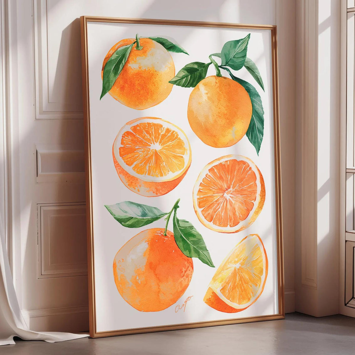 A framed print featuring vibrant illustrations of oranges, including whole oranges and slices, with green leaves.