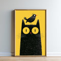 A framed illustration of a black cat with a bird perched on its head, set against a yellow background.