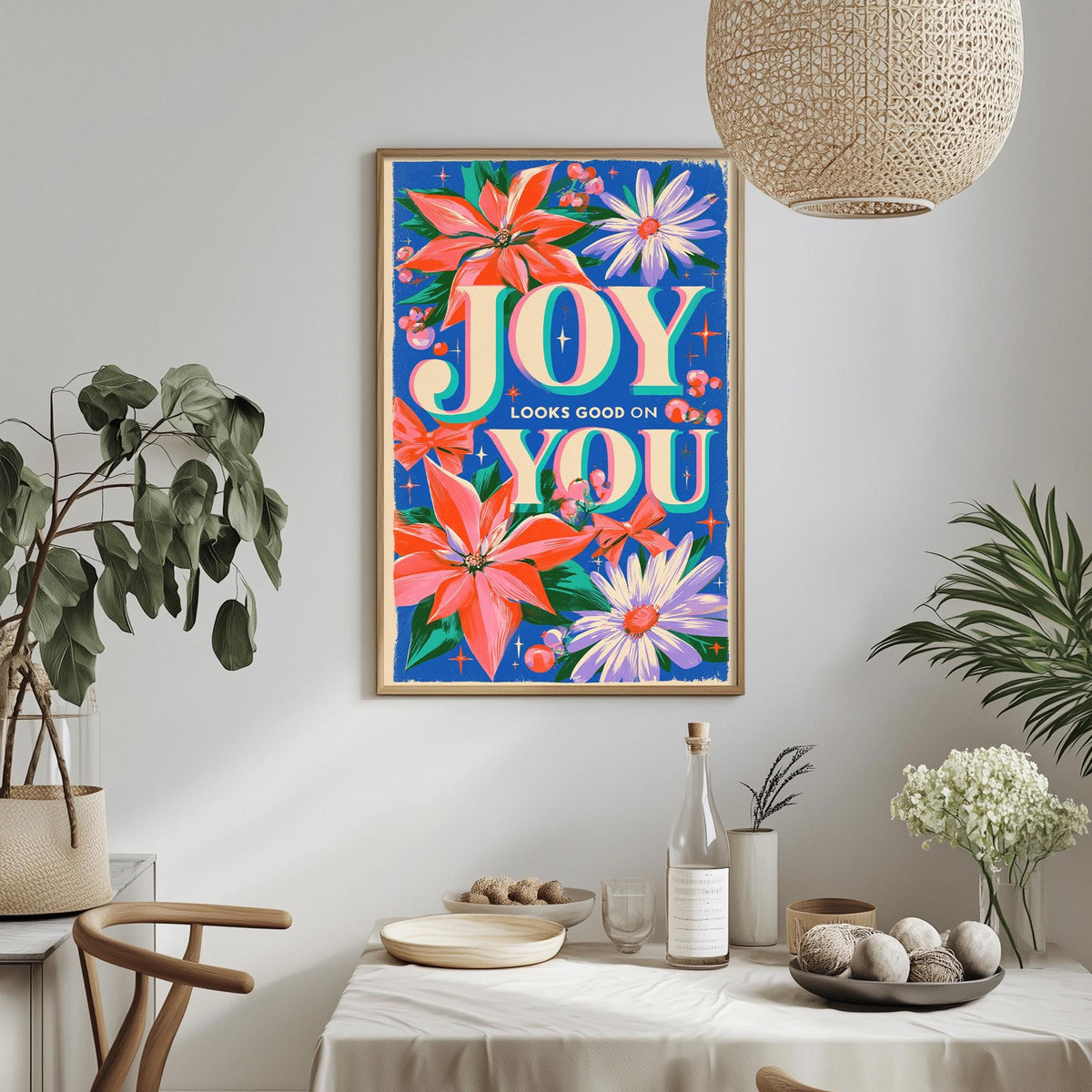 a vibrant and colorful poster hanging on a wall, surrounded by various decorative elements such as potted plants, vases, and a dining table.