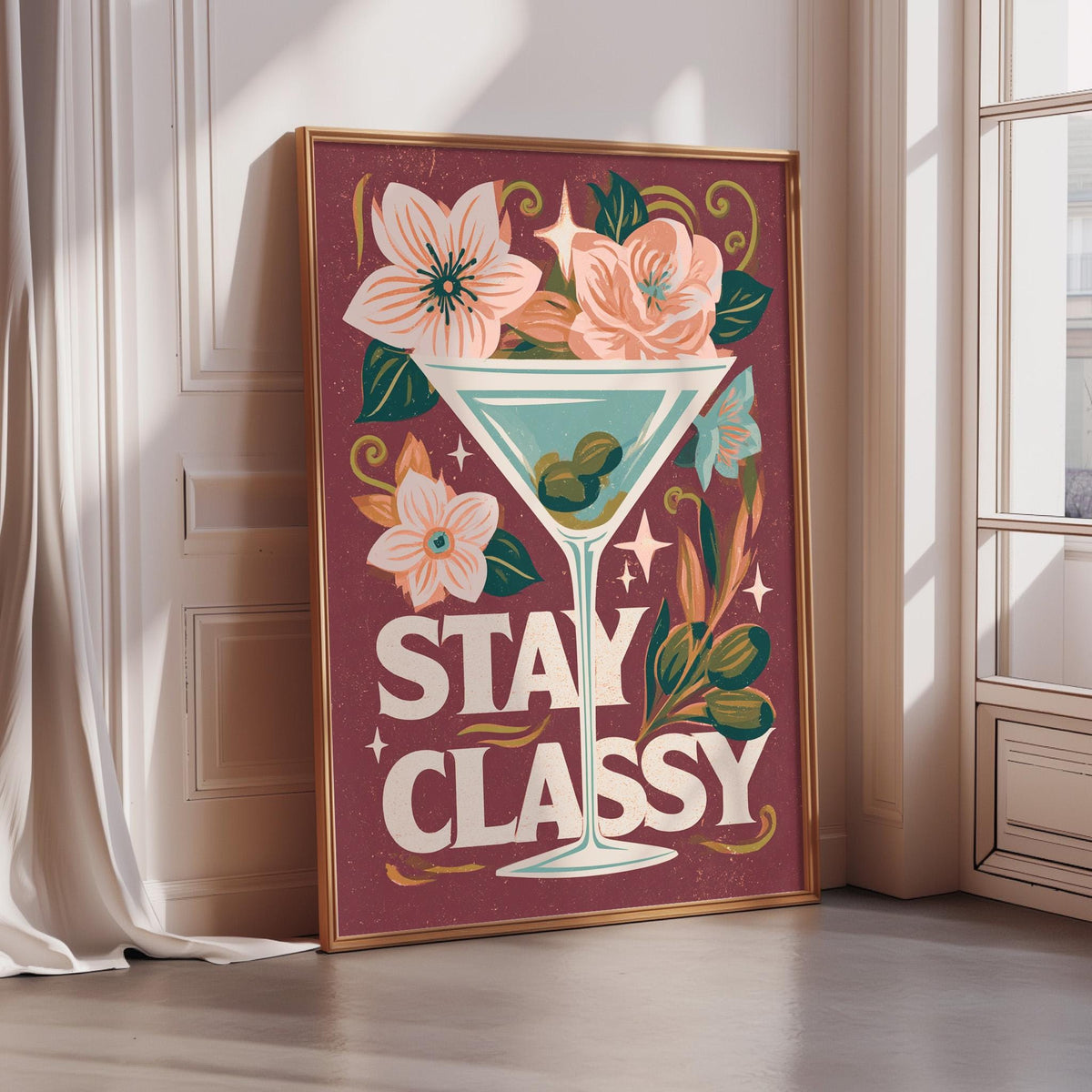 A framed poster with a floral design and a martini glass, along with the text "STAY CLASSY" in a stylized font.