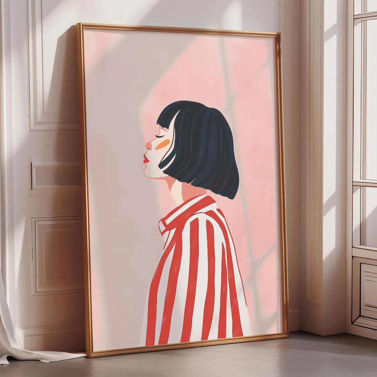 a framed illustration of a woman with short black hair wearing a red and white striped shirt.