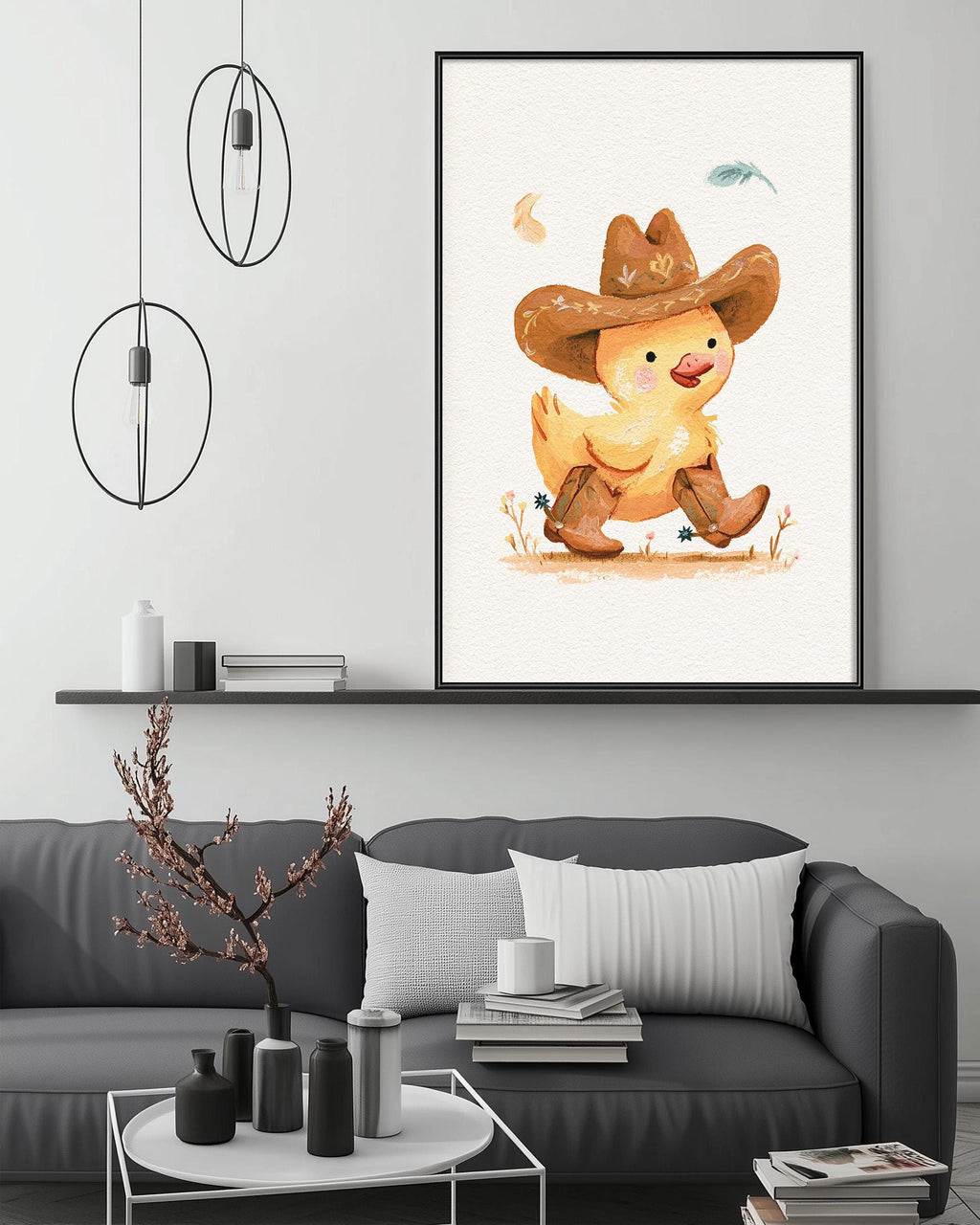 a cozy living room with a gray couch, a coffee table, and a framed illustration of a duck wearing a cowboy hat and boots.