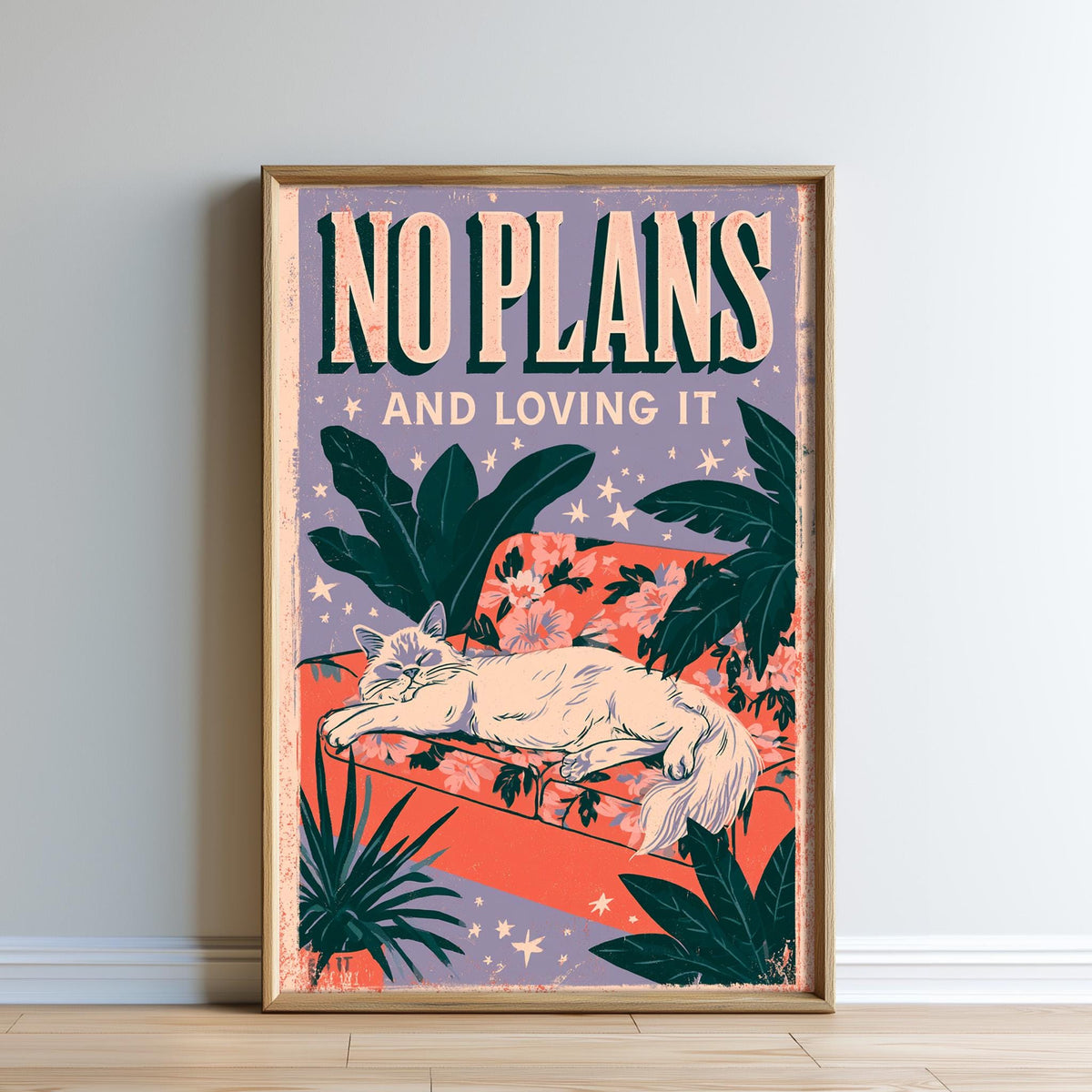 The image is a framed poster with a cat sitting on a couch, surrounded by tropical plants and flowers. The poster has a colorful and whimsical design, with the text "NO PLANS AND LOVING IT" prominently displayed.
