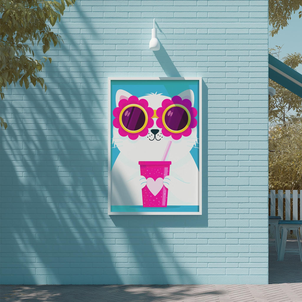 A framed poster of a cat wearing sunglasses and holding a pink drink is displayed on a blue brick wall.