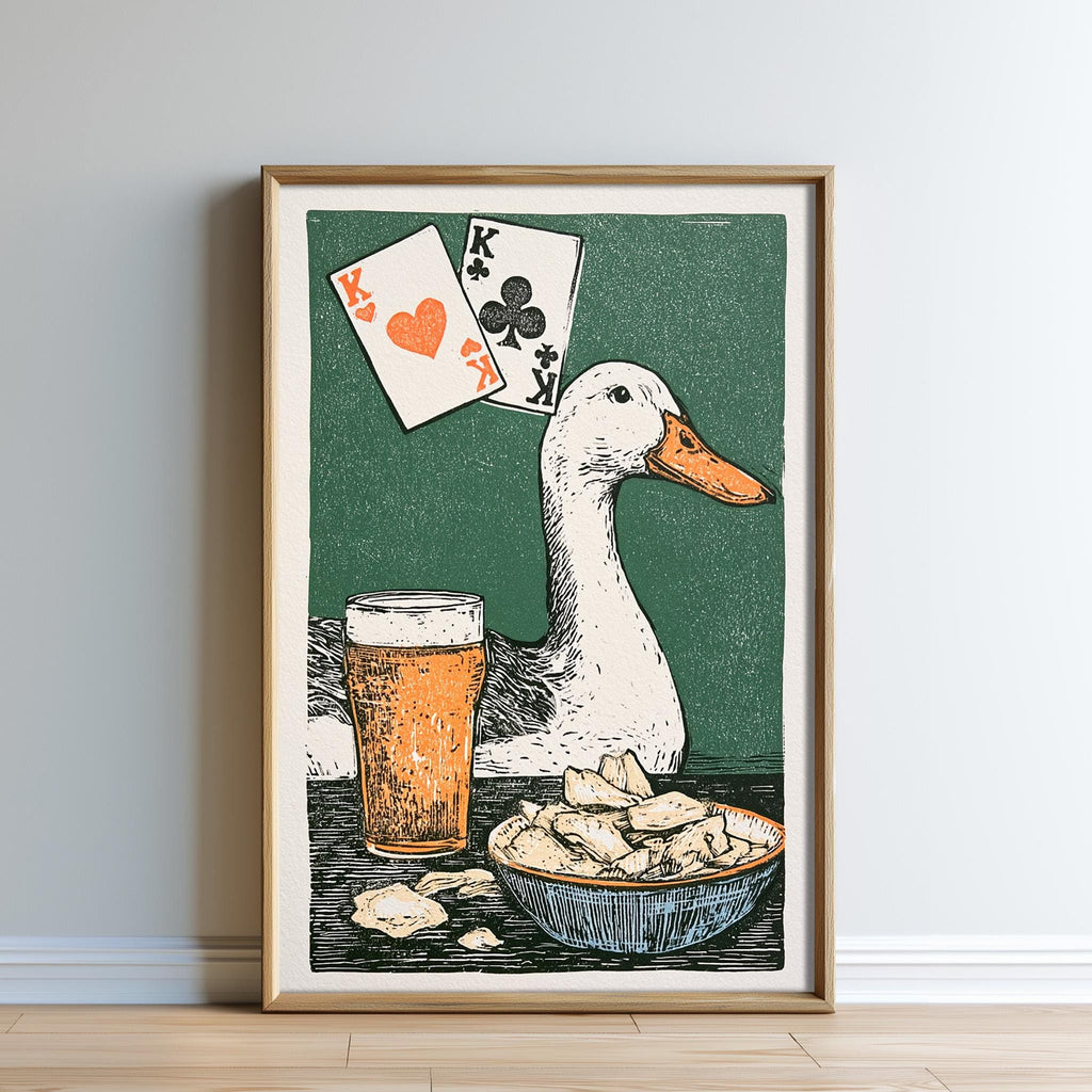 A framed illustration depicting a duck sitting next to a bowl of chips and a glass of beer, with playing cards and a green background.