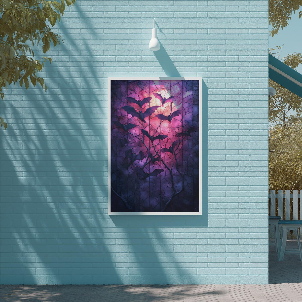 a large framed painting of bats hanging on a blue wall.