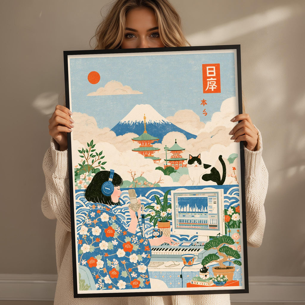 A woman is holding up a framed poster with a vibrant illustration depicting a woman in traditional Japanese clothing, a cat, and a computer monitor, with a mountain in the background.